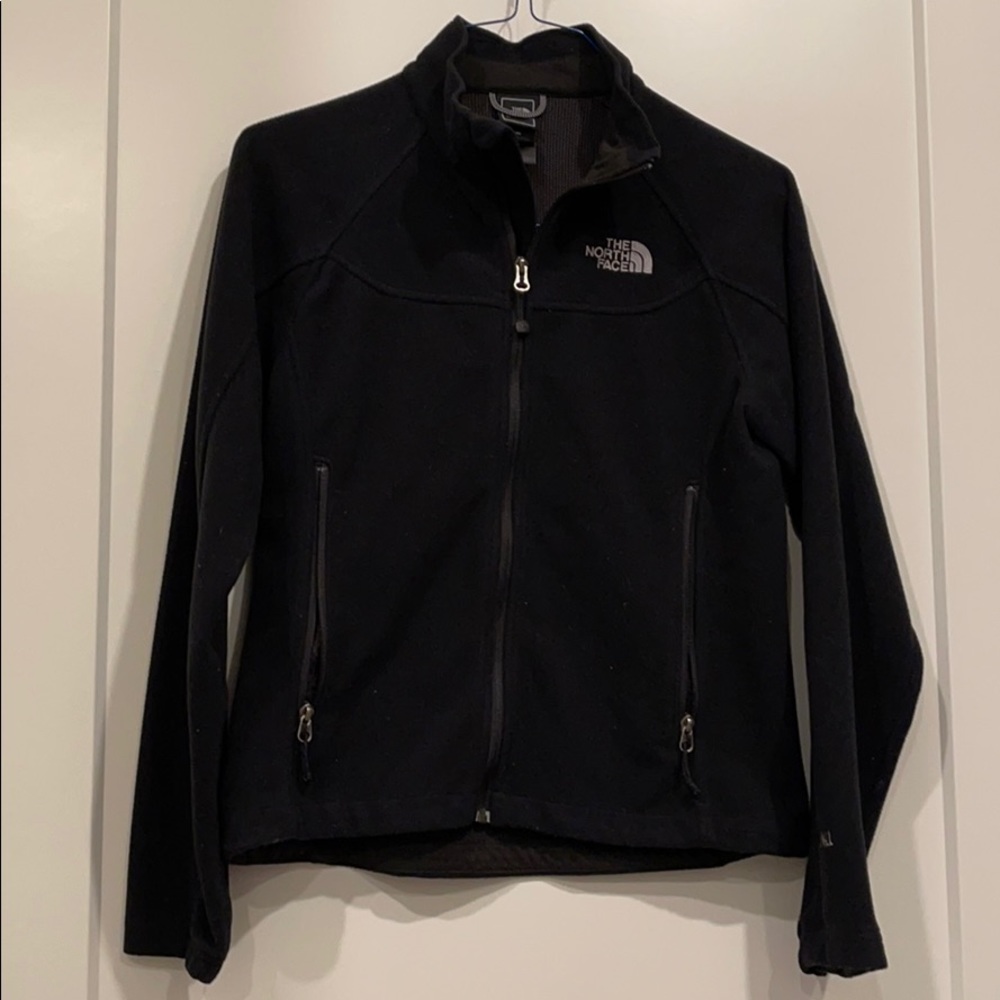 Black full zip North Face Jacket.